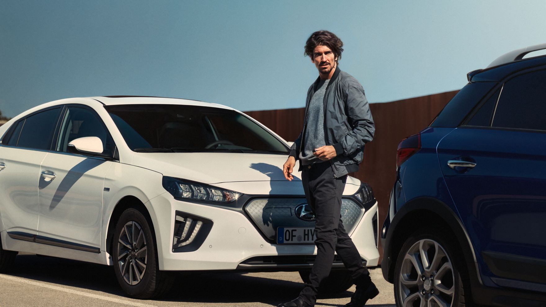 Design sketch of the all-new Hyundai Tucson compact SUV pictured from the rear and side.